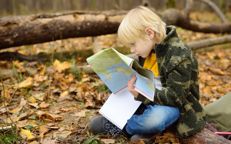 A boy holding a map