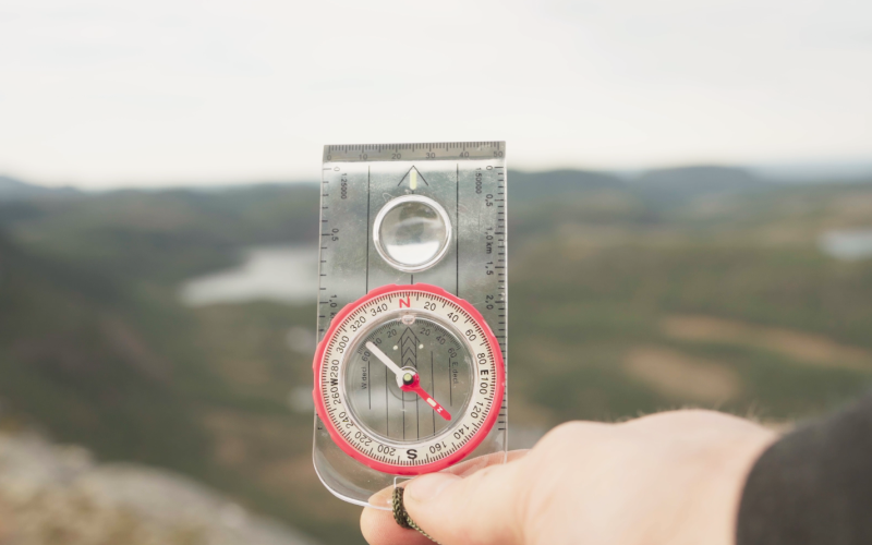 Man holding a compass