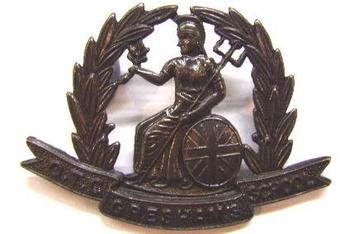 Gresham School OTC cap badge